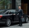 lucid origin_A_realistic_camera captured_scene_of_a_professional_chauffeur_welcoming_a_VIP_co 0 95x90
